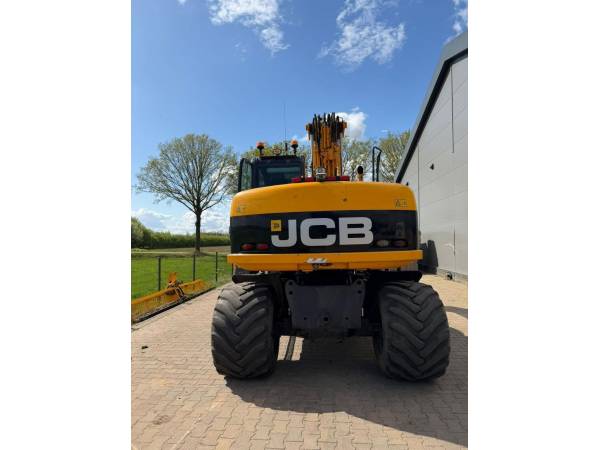 Екскаватор-навантажувач JCB JS145W (2008)